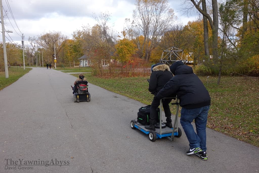 Lene being chased by a camera crew on a dolly