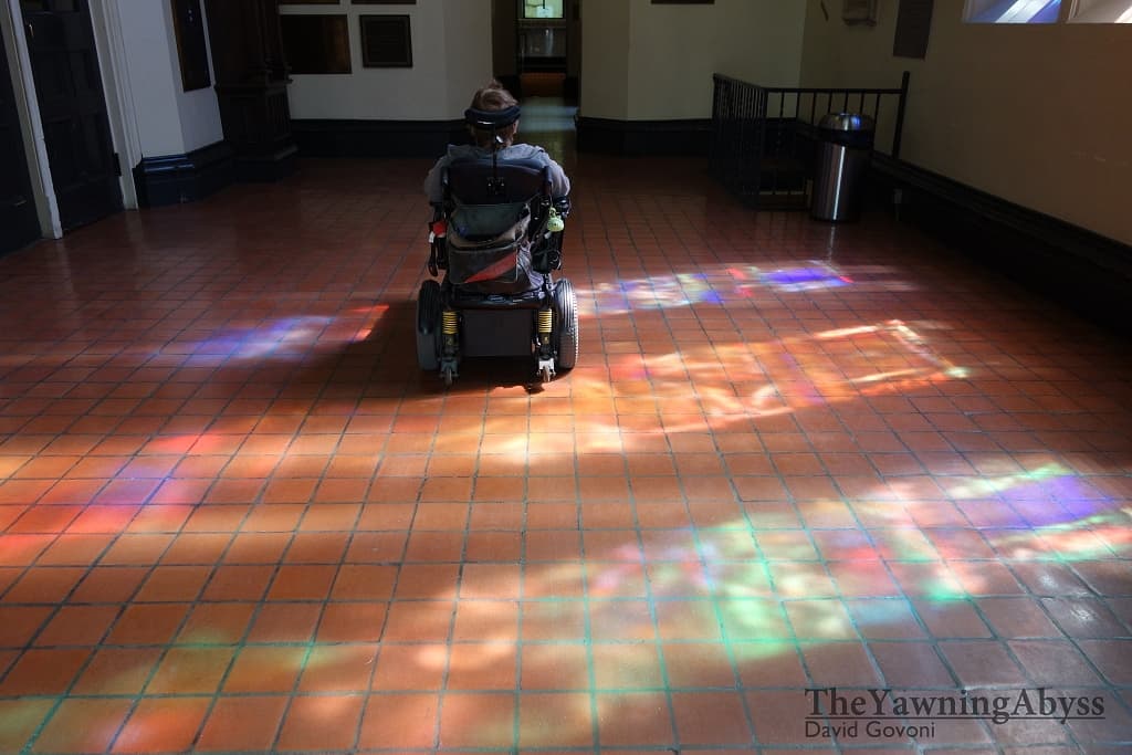 Lene gliding through a church foyer